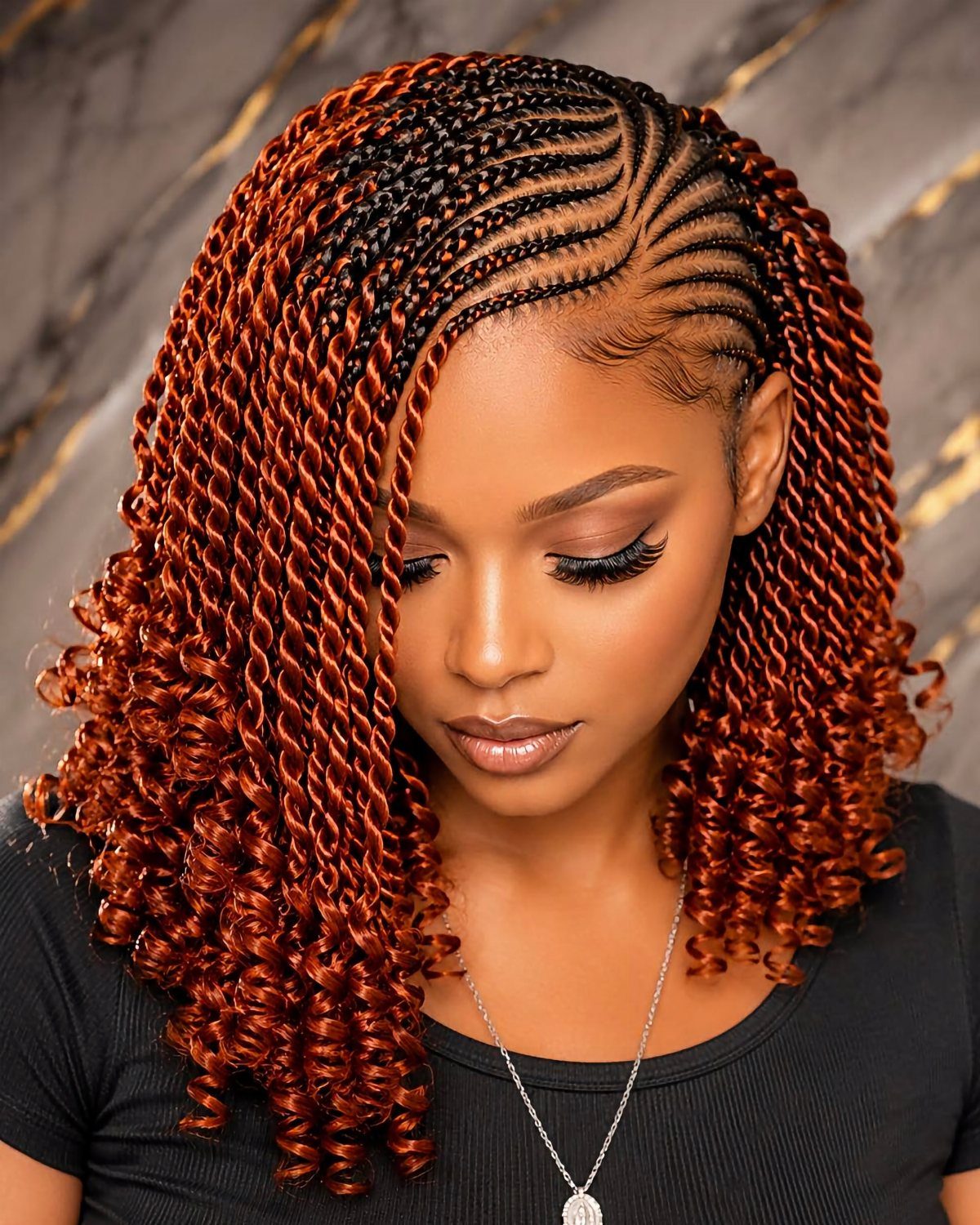 Woman with black cornrows transitioning into glossy copper-red twists with curled ends