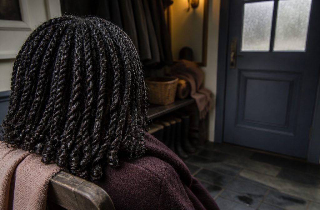 Natural hair styled in small rope twists around the head