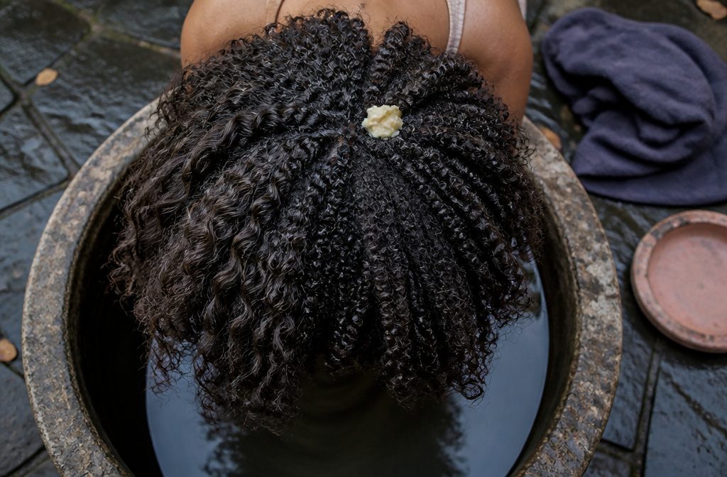 Natural hair textures with loose waves springy curls and tight coils